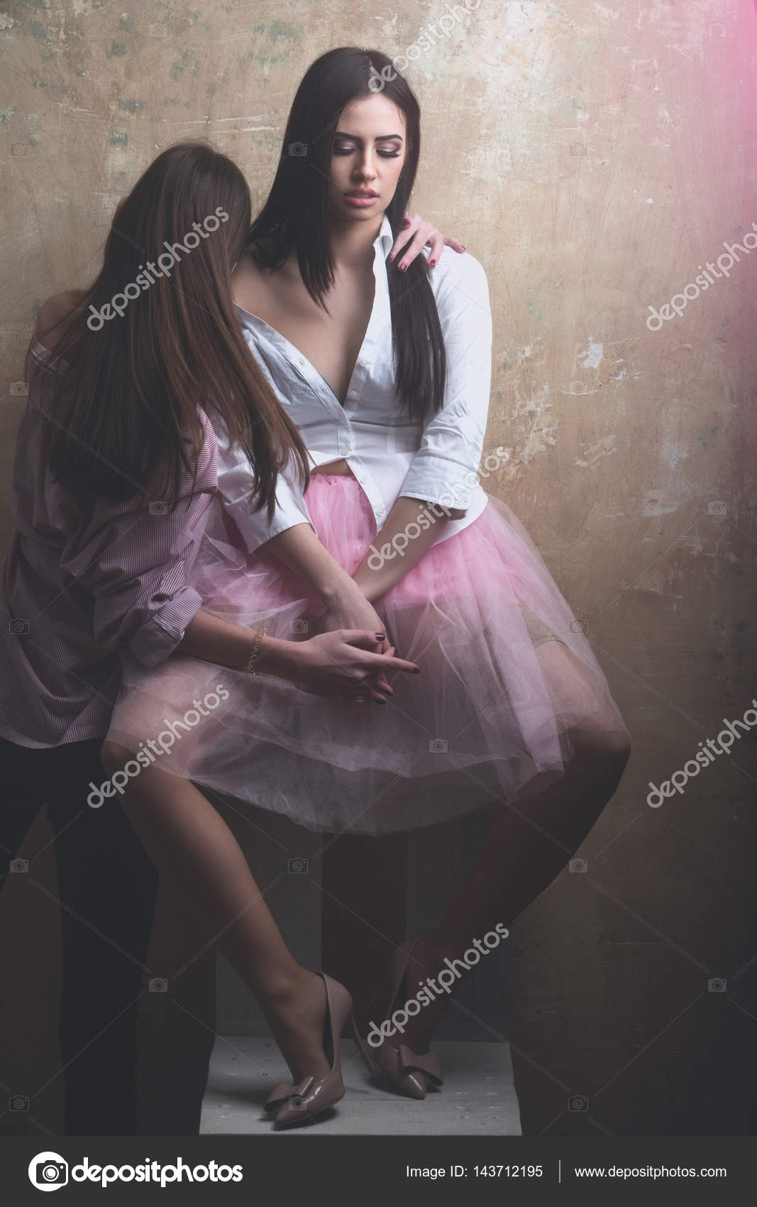 Pretty Sexy Women In Pink Skirt And Shirt On Chair Stock Photo