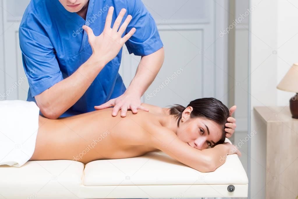 sexy pretty woman on spa salon massage with male hands