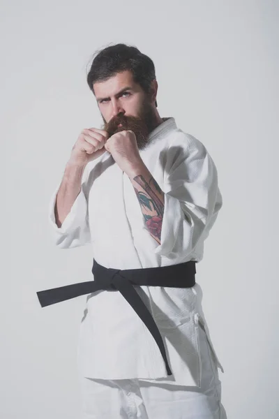 Bearded karate man, brutal caucasian serious hipster in kimono — Stock Photo, Image