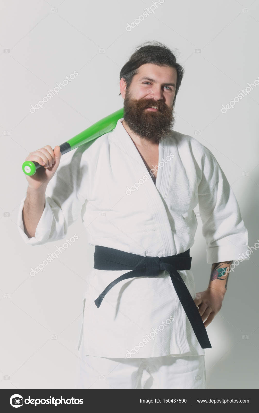 Bearded smiling karate man in kimono with green baseball bat Stock Photo by © 150437590 Bearded smiling karate man in kimono with green baseball bat Stock Photo by © 150437590