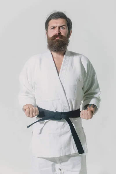 Bearded karate man, brutal caucasian serious hipster in kimono — Stock Photo, Image