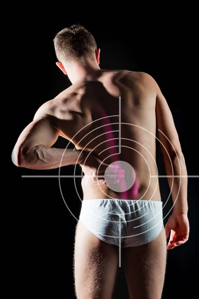 man suffers from kidney pain standing over black background