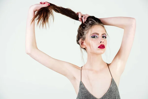 Sexy glamour girl with long curly hair and glitter makeup — Stock Photo, Image