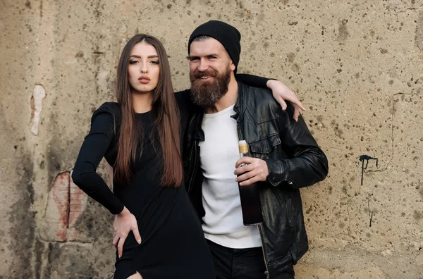 Couple in love, sexy girl and happy man with bottle — Stock Photo, Image