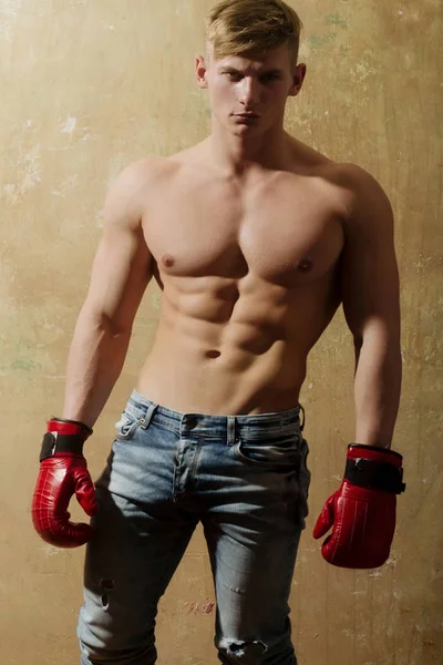 Athlete in red, boxing gloves with muscular torso — Stock Photo, Image