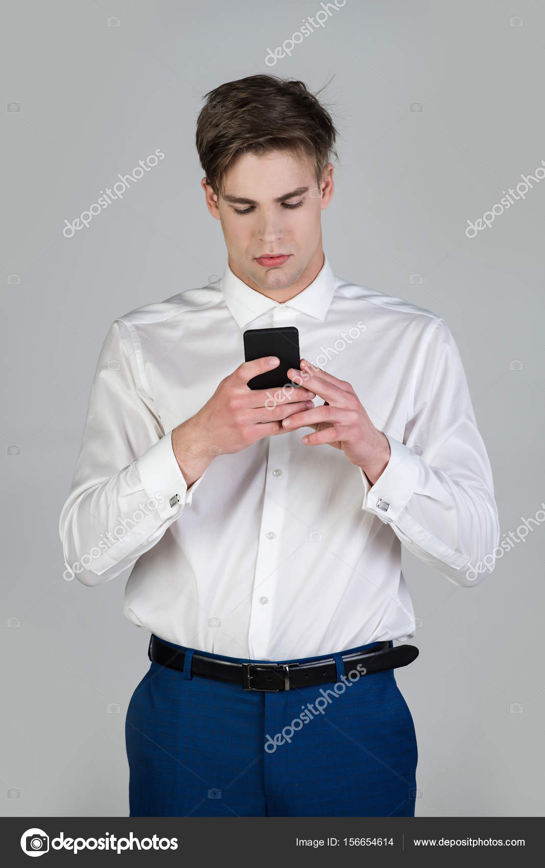 grey shirt and blue pants