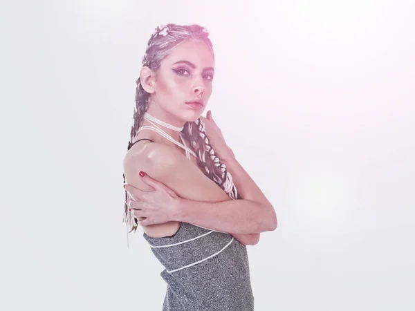 Woman with stylish braids posing in grey dress — Stock Photo, Image