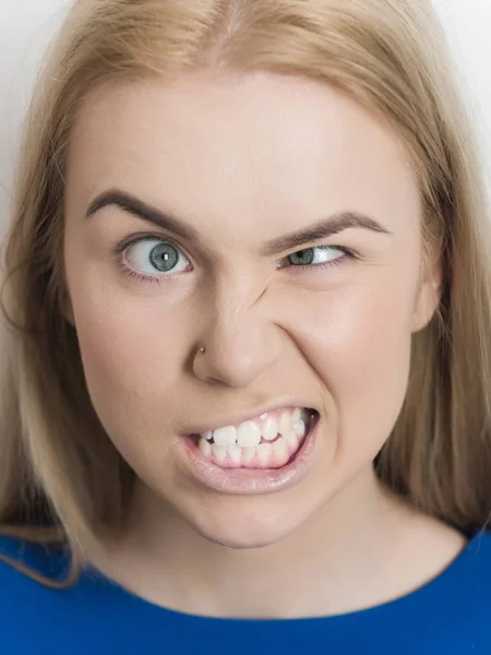 Woman squinting eyes on silly face — Stock Photo, Image
