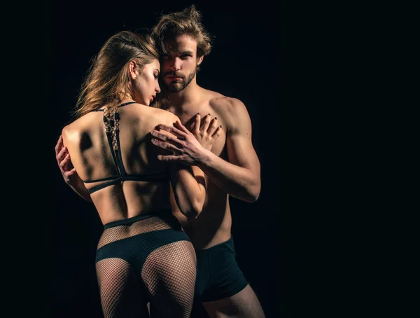 Macho and girl in sexy underwear — Stock Photo, Image