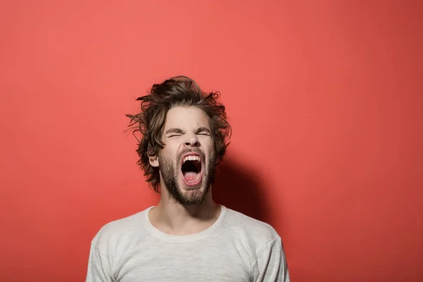 Shouting or yawning man with long uncombed hair, morning, headache — Stock Photo, Image