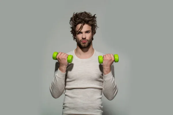 Man with barbell doing morning exercise, has uncombed hair — Stock Photo, Image