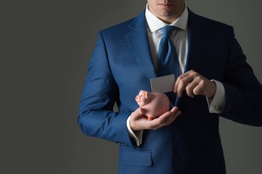 Şık resmi Mavi takım elbise ve kumbara