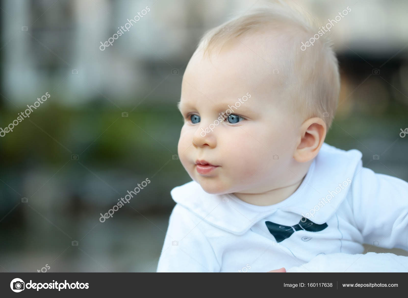 Cute Baby Boy With Blue Eyes And Blond Hair Stock Photo