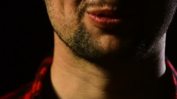 Male mouth with saliva and beard. Man is playing with chewing gum and saliva. Bearded young guy and food. Man close up in a plaid shirt, man's habits, chewing, boy chewing — Stock Video
