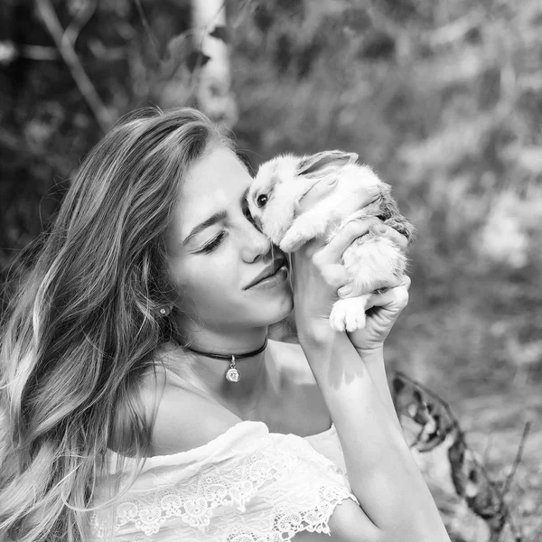 model woman kisses rabbit