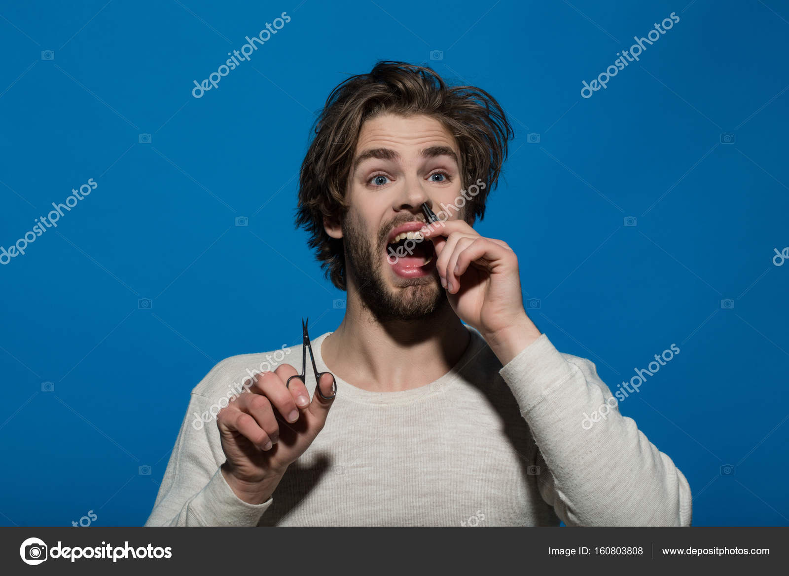 Man Barber Twitch Nose Hair With Tweezers And Hold Scissors