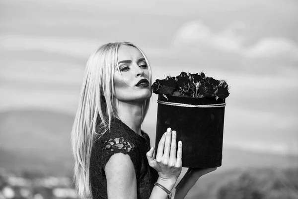 Girl with flowers in box — Stock Photo, Image