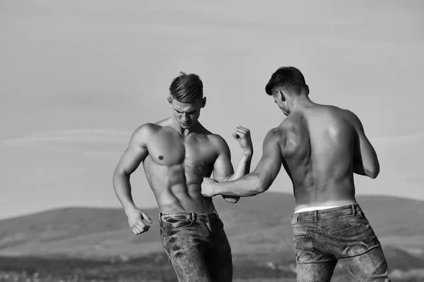 Twin men or bodybuilders — стоковое фото