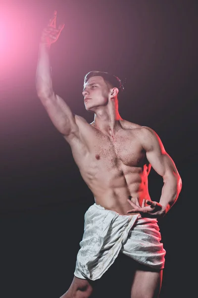 Man muscular body in white fascia pose as bodybuilder — Stock Photo, Image