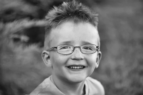 Happy baby boy with hair in glasses — Stock Photo, Image