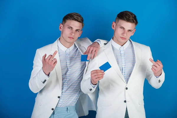 Businessmen showing middle fingers in white jackets