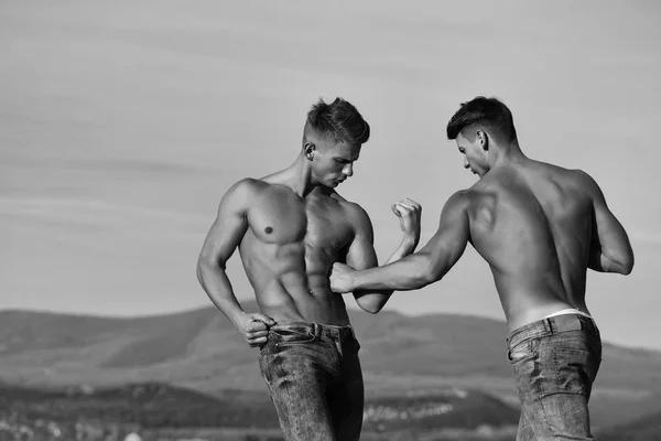 Twin men or bodybuilders — стоковое фото