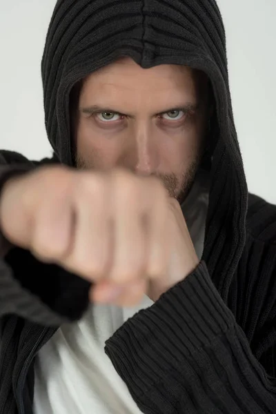 Fist of man fighter with serious face punching — Stock Photo, Image