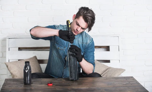 Man refilling cartridge toner for printer