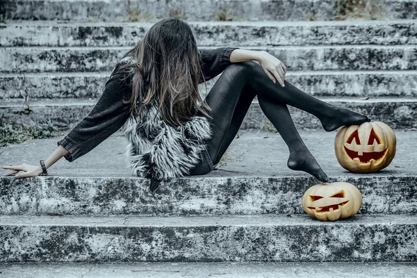Halloween girl with pumpkins — Stock Photo, Image