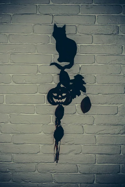 Halloween black cat, pumpkin and tree leaves silhouette paper cutouts — Stock Photo, Image