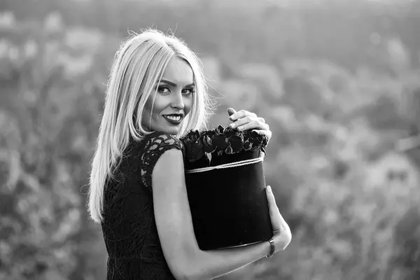 Girl with flowers in box — Stock Photo, Image