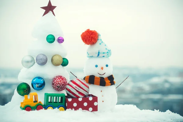 Snow sculptures on white sky background — Stock Photo, Image