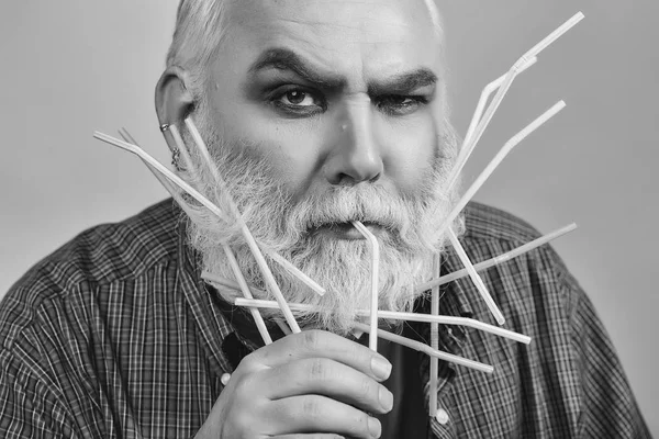 old man with drinking straws in beard