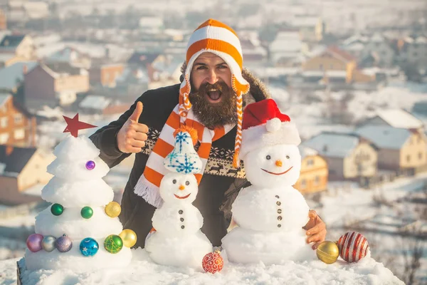 Happy hipster in hat on winter day