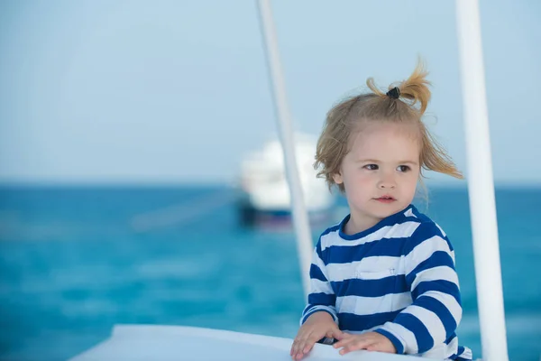 Boy little kid with cute serious face sailing on ship. — Stock Photo, Image
