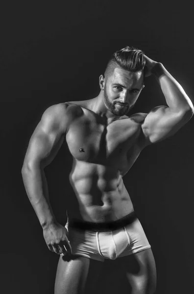 Handsome muscular macho man with sexy athlete body in pants — Stock Photo, Image