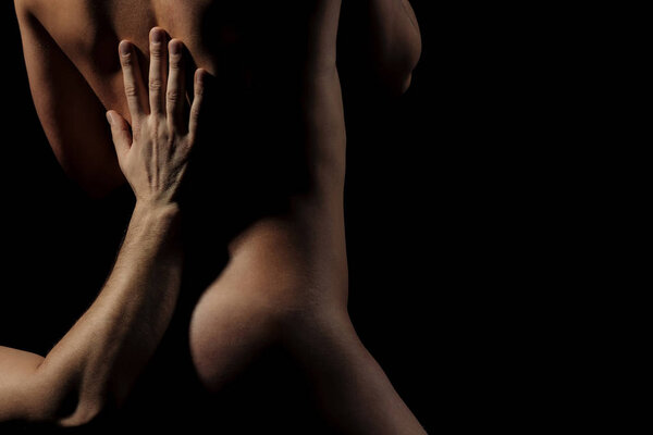 hand of man making massage on naked sexy woman