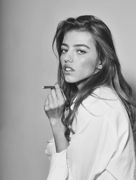 Pretty sexy woman or girl with long hair smoking cigarette — Stock Photo, Image