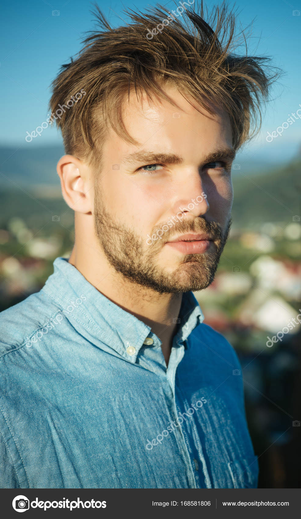 Man with bearded face and haircut posing in blue shirt Stock Photo by  © 168581806