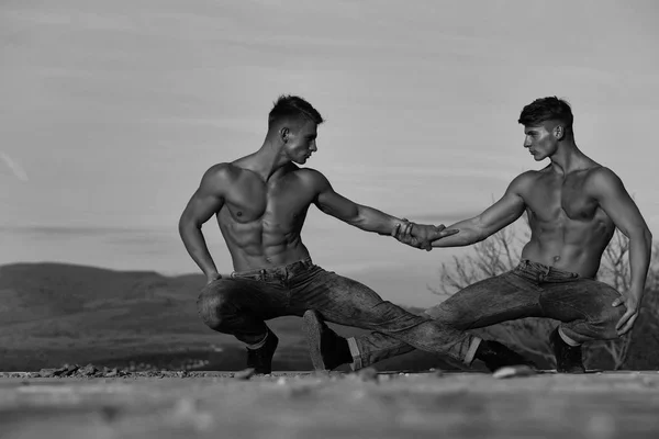 Twin men or bodybuilders wrestling — Stock Photo, Image