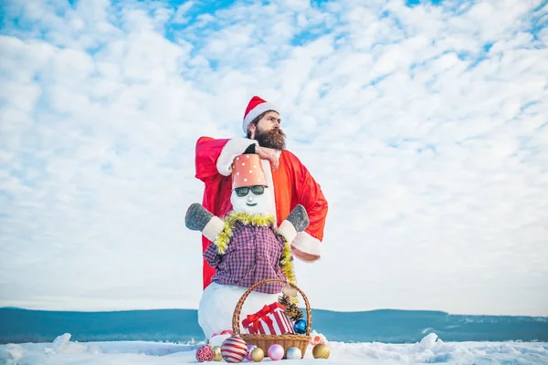 Snowman in glasses and bucket on head — Stock Photo, Image