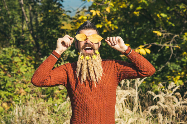Man with natural spikelet beard sunny fall.