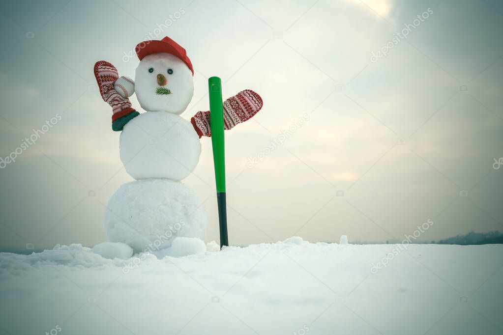 New year snowman from snow in cap and mittens.