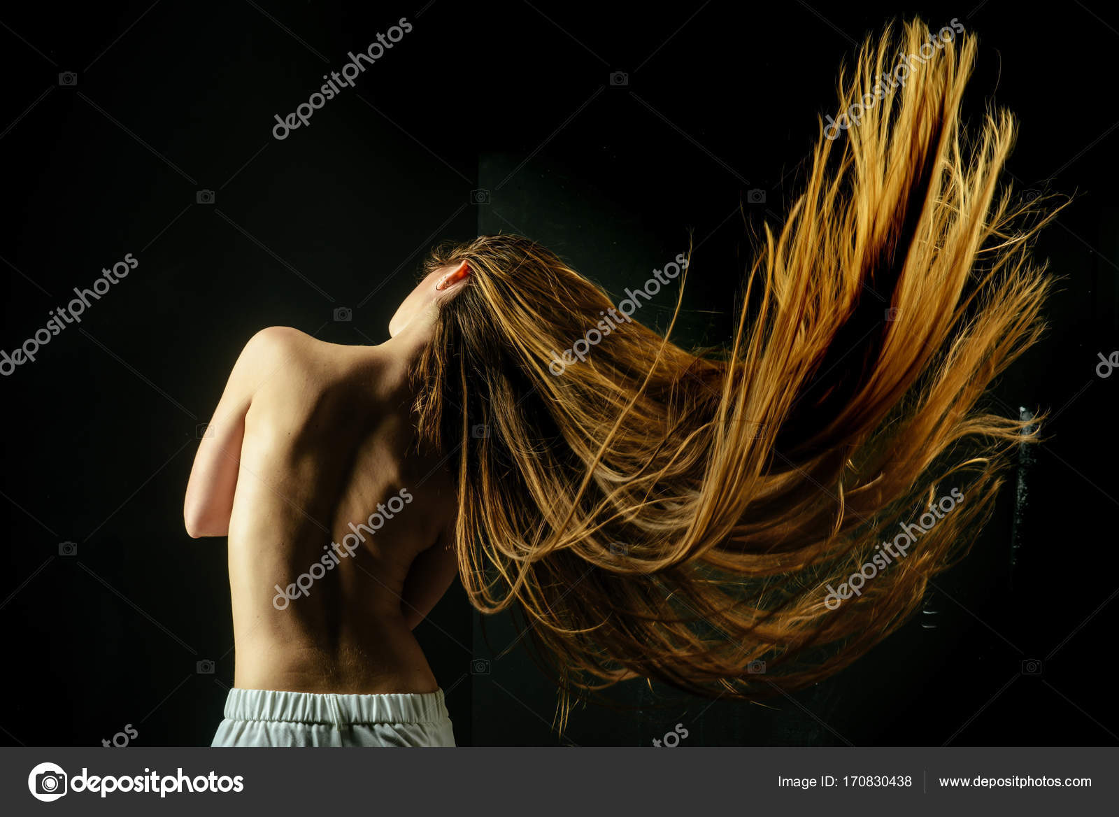 Woman With Stylish Long Hair And Naked Back Stock Photo