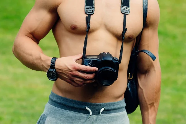 Camera hang on naked torso — Stock Photo, Image