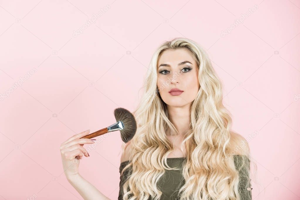 Girl with makeup brush.