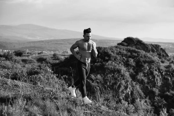 Sexy muscular man running outdoor — Stock Photo, Image