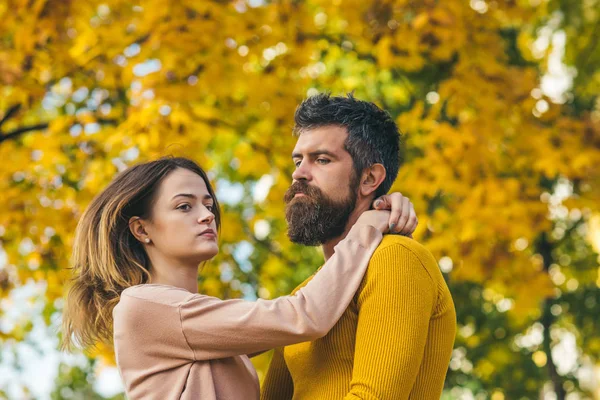 Couple in love in autumn park.