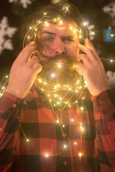New year guy with illuminated wire. — Stock Photo, Image