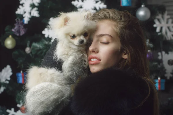 Christmas woman with pretty face and pet.